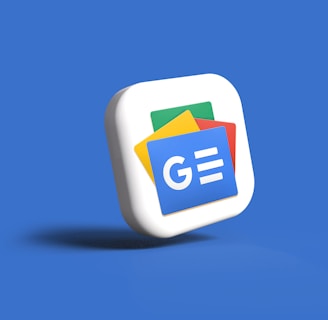 A 3D icon of a stack of cards with the Google News logo, featuring blue, green, yellow, and red colors, set against a solid blue background.