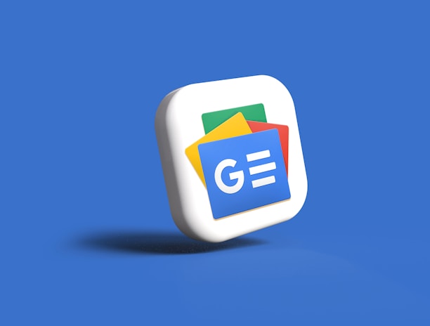 A 3D icon of a stack of cards with the Google News logo, featuring blue, green, yellow, and red colors, set against a solid blue background.
